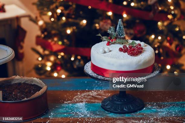 fondant christmas cake with dried fruits and nuts - christmas cake stock pictures, royalty-free photos & images