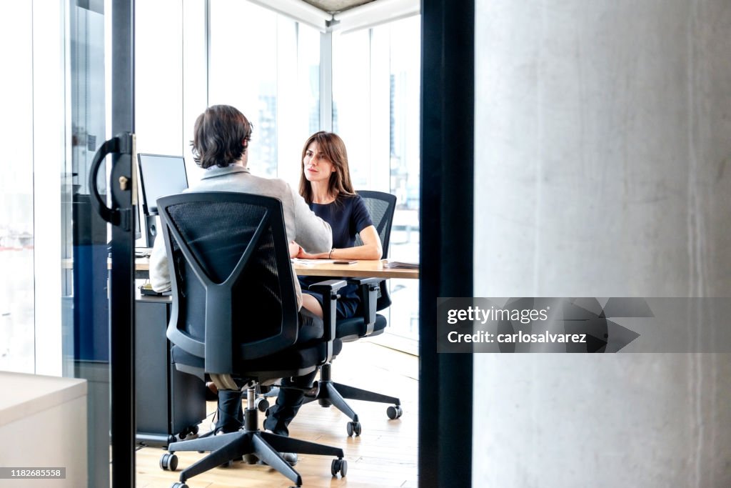 Woman Interviewing a man for a job