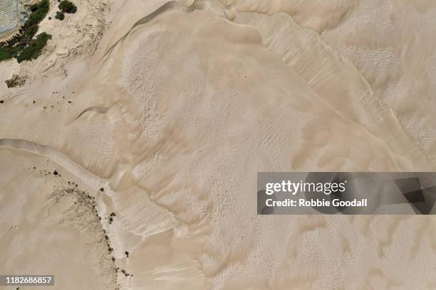 aerial view of sand dunes - desert stock-fotos und bilder