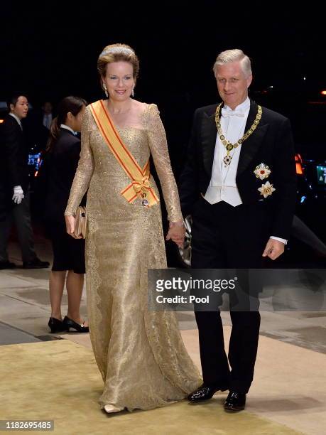 King Philippe of Belgium and Queen Mathilde of Belgium arrive to attend the Court Banquet at the Imperial Palace on October 22, 2019 in Tokyo, Japan.