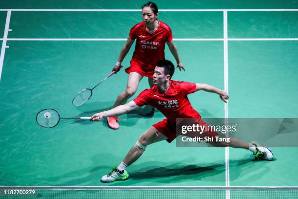 Zheng Siwei and Huang Yaqiong of China compete in the Mixed Doubles first round match against Goh Soon Huat and Lai Shevon Jemie of Malaysia on day...