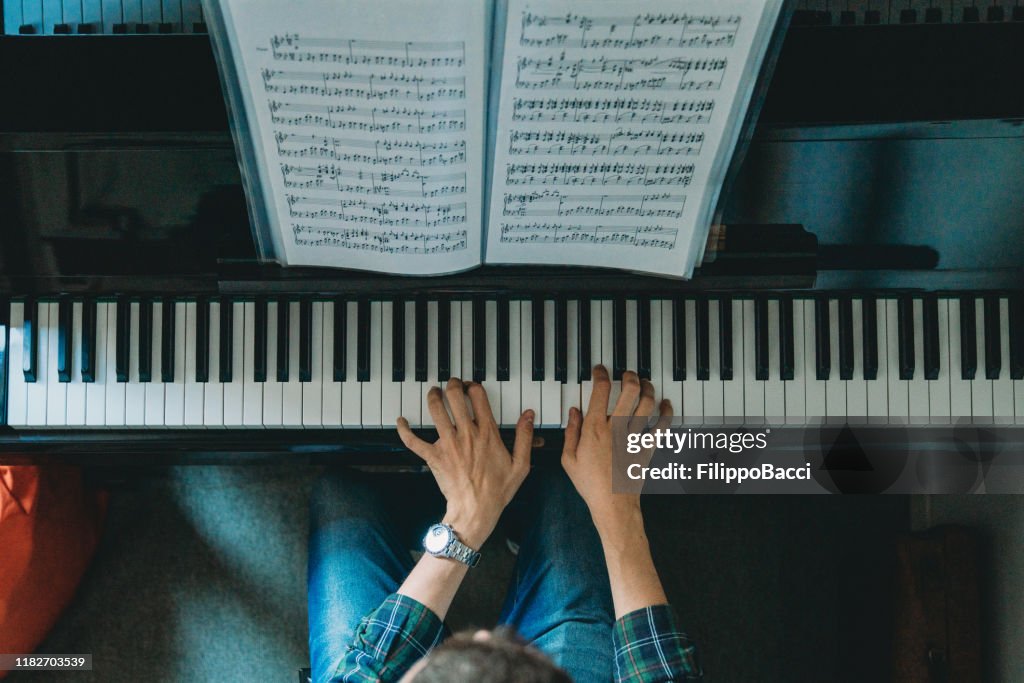 High angle view of a pianist playing piano