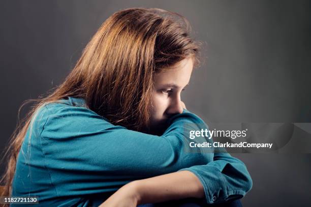 candid portrait of a lonely teenager - mental illness child stock pictures, royalty-free photos & images