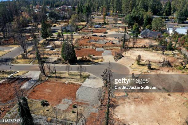 An aerial view of a neighborhood destroyed by the Camp Fire October 21, 2019 in Paradise, California. It has been one year since the the Camp Fire...