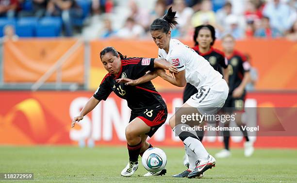 Abby Erceg of New Zealand and Charlyn Corral of Mexico battle for the ball during the FIFA Women's World Cup 2011 Group B match between New Zealand...