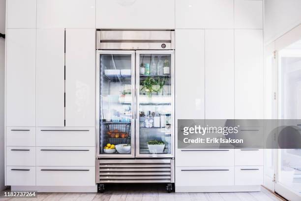glass refrigerator in modern kitchen - white refrigerator stock pictures, royalty-free photos & images