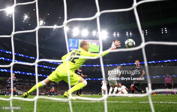 Erik Lamela of Tottenham Hotspur scores his team's fourth goal past Milan Borjan of Crvena Zvezda during the UEFA Champions League group B match...