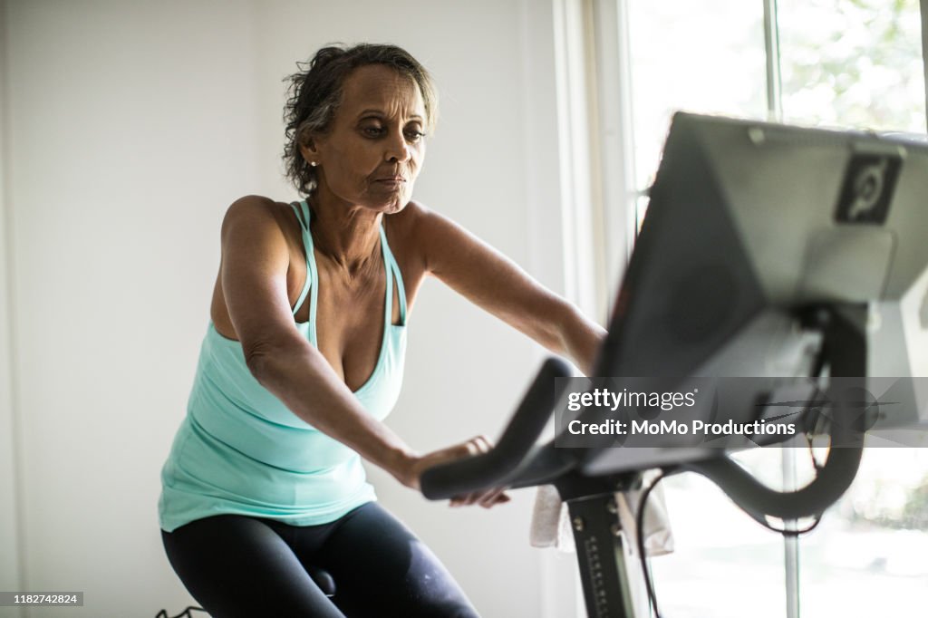 Senior woman on exercise bike