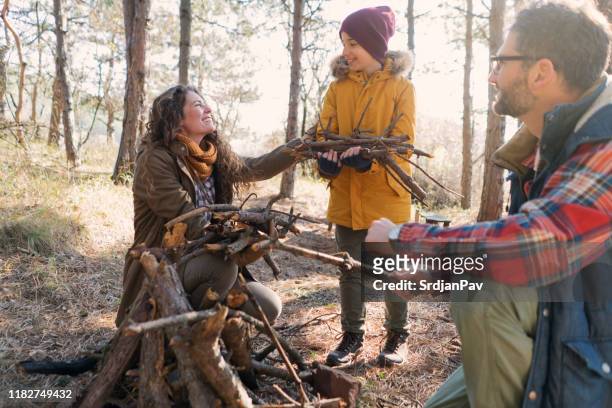 family on camping - firewood stock pictures, royalty-free photos & images