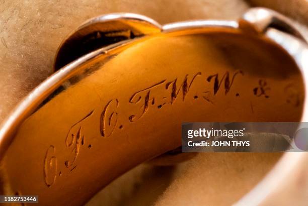 Picture taken on October 30, 2019 at the apartment of Arthur Brand in Amsterdam shows a close-up of the 18-carat golden friendship ring with an...