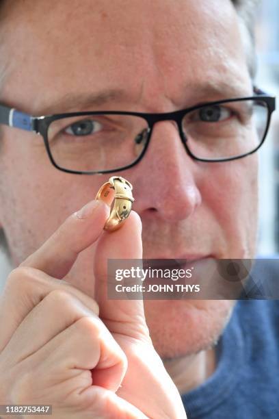 Arthur Brand, also dubbed the "Indiana Jones of the Art World", poses with an 18-carat golden ring, which is said to have belonged to Irish...