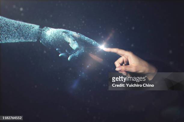 artificial intelligence robot finger touching to human finger - human finger stock pictures, royalty-free photos & images