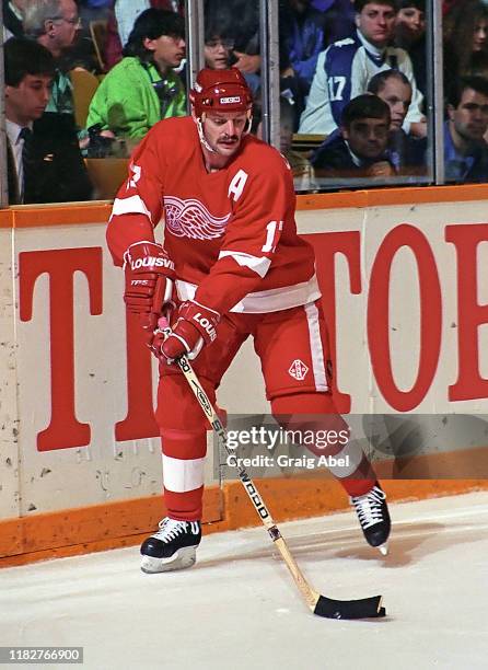 Gerard Gallant of the Detroit Red Wings skates against the Toronto Maple Leafs during NHL game action October 10, 1990 at Maple Leaf Gardens in...