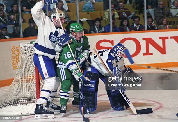 Jeff Reese and Al Iafrate of the Toronto Maple Leafs skate against Pat Verbeek of the Hartford Whalers during NHL game action October 17, 1990 at...