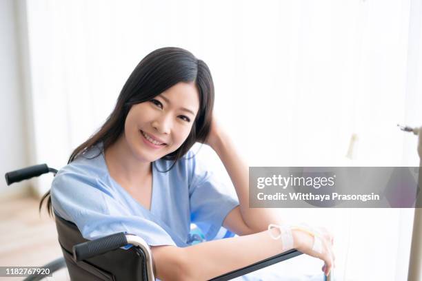 beautiful ethnic woman with cancer smiles - critical illness stock pictures, royalty-free photos & images