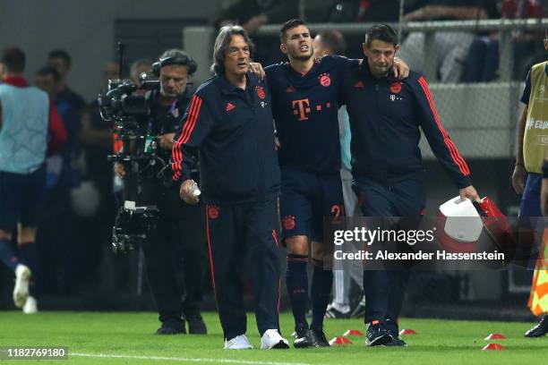 Lucas Hernandez of FC Bayern Munich receives medical treatment during the UEFA Champions League group B match between Olympiacos FC and Bayern...