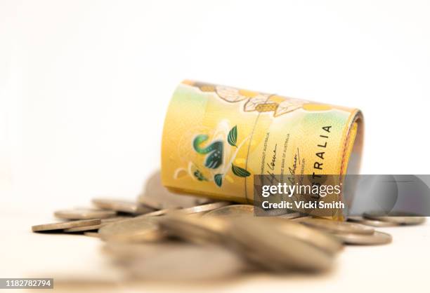 a roll of $50 notes and coins australia - australian dollars stock pictures, royalty-free photos & images