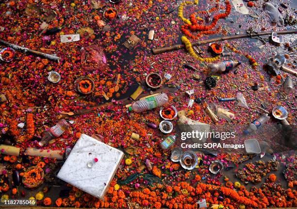 Garbage floats on Ganga River Bank in Varanasi. River Ganga is sick in Varanasi. Along the Ghats of Varanasi, Ganga water is polluted in which about...