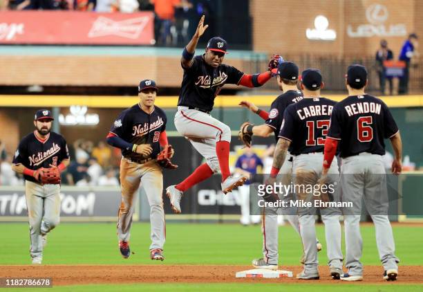 Victor Robles of the Washington Nationals celebrates with his teammates after their 5-4 win over the Houston Astros in Game One of the 2019 World...
