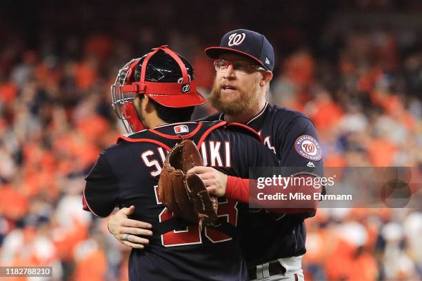 Kurt Suzuki and Sean Doolittle of the Washington Nationals celebrate their 5-4 win over the Houston Astros in Game One of the 2019 World Series at...