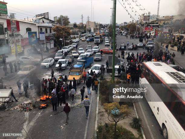 Protesters set fire as they block the roads during a protest against gasoline price hike at Damavand of Tehran, Iran on November 16, 2019.