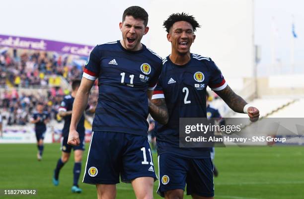 Ryan Christie celebrates with his teammate Liam Palmer after making it 1-0 to Scotland during the UEFA European qualifier between Cyprus and...