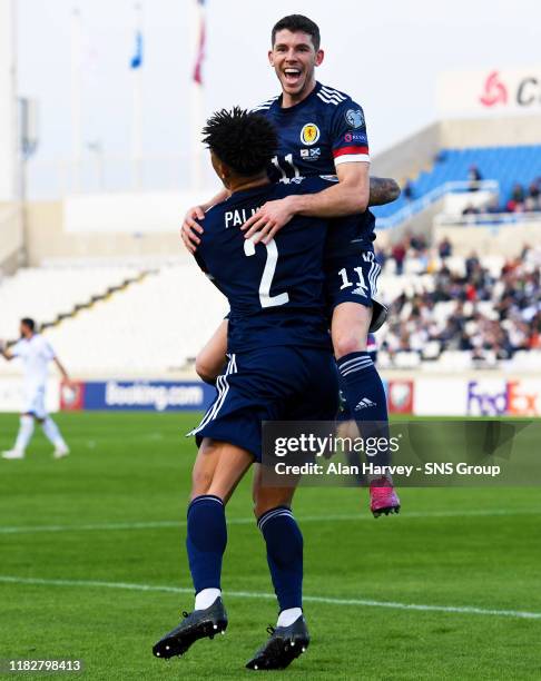 Ryan Christie celebrates with his teammate Liam Palmer after making it 1-0 to Scotland during the UEFA European qualifier between Cyprus and...