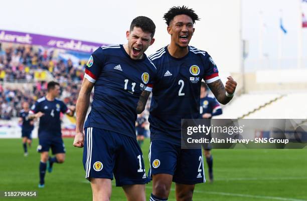 Ryan Christie celebrates with his teammate Liam Palmer after making it 1-0 to Scotland during the UEFA European qualifier between Cyprus and...