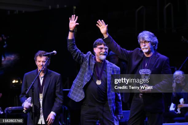 Inductees Jeff Cook, Randy Owen and Teddy Gentry of Alabama speak onstage during the 2019 Musicians Hall of Fame Induction Ceremony & Concert at...