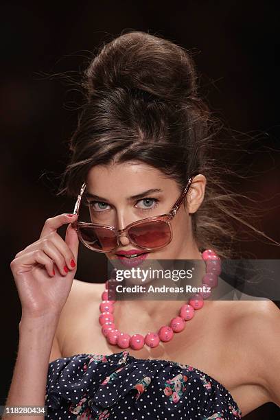 Model Marie Nasemann walks the catwalk at the Lena Hoschek Show during Mercedes-Benz Fashion Week Berlin Spring/Summer 2012 at the Brandenburg Gate...