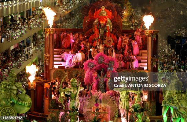 Members of the "Mangueira" samba school perform a top of a float at the Sambadrome during carnival celebrations in Rio de Janeiro, Brazil, 18...