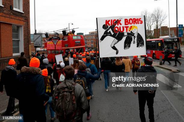 Protestors participate in an anti-Boris Johnson rally in his constituency Uxbridge, west London on November 16, 2019. - Britain goes to the polls on...