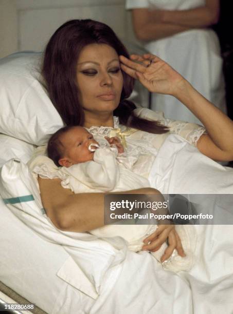 Italian film actress Sophia Loren with her new baby boy, circa 1970.