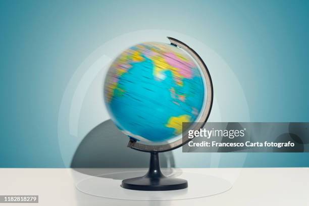 world globe in a bubble - turning stock pictures, royalty-free photos & images