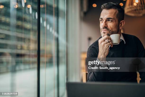 handsome gentleman on coffee break in cafe - chinese restaurant interior stock pictures, royalty-free photos & images