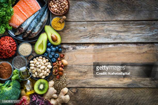 healthy eating: selection of antioxidant group of food frame. copy space - food and drink stock pictures, royalty-free photos & images