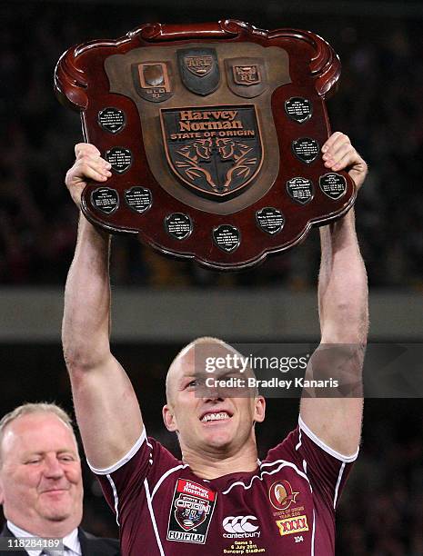 Darren Lockyer of the Maroons holds up the winners shield after game three of the ARL State of Origin series between the Queensland Maroons and the...