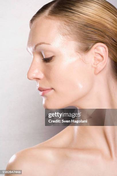 side view of woman having beauty treatment - shiny hair back stock pictures, royalty-free photos & images