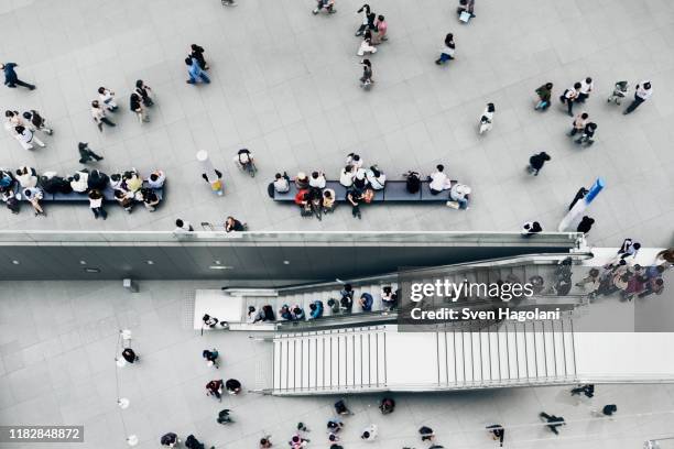 view above people in a public square - shopping centre escalator stock pictures, royalty-free photos & images