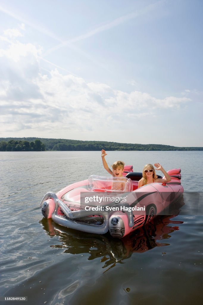 Child Inflatable Raft Two Children In An Inflatable Raft On A Lake High-Res Stock Photo ...