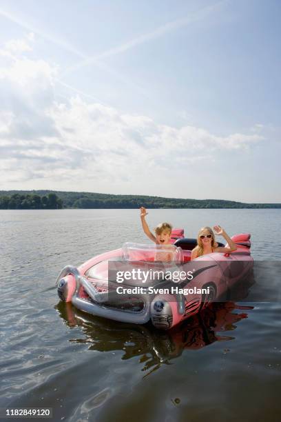 Small Child Raft Two Children In An Inflatable Raft On A Lake High-Res Stock Photo ...
