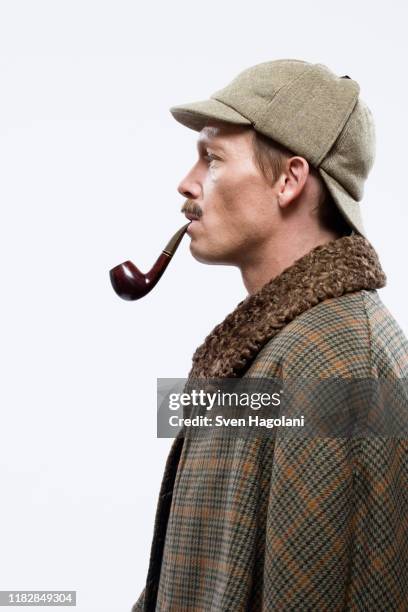 a man dressed up as sherlock holmes - deerstalker hat stock pictures, royalty-free photos & images