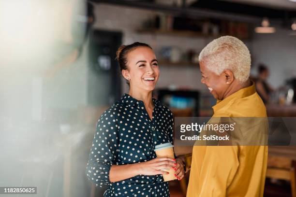 enjoying their breaks together - multiracial group stock pictures, royalty-free photos & images