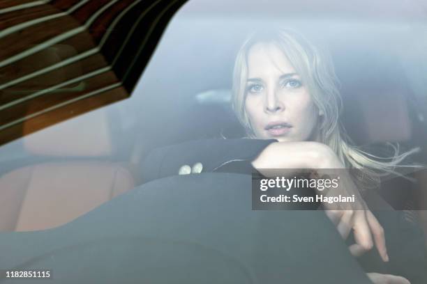 pensive woman driving - car front view foto e immagini stock