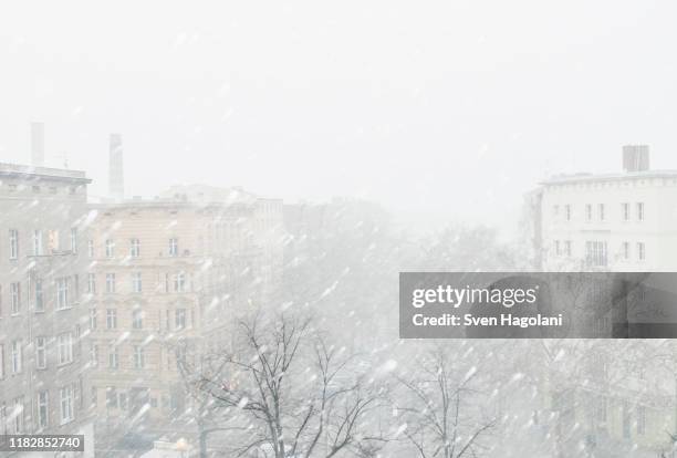 city during snowfall against clear sky - germany snow stock pictures, royalty-free photos & images