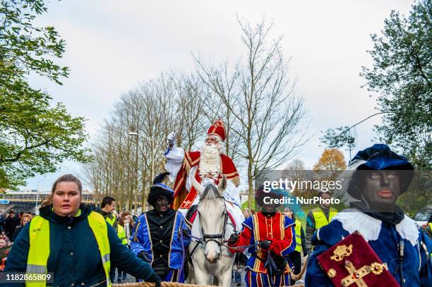 Sinterklaas is seen greeting to the public accompanied by black-faced helpers, during his entry in Nijmegen, on November 16th, 2019. The Dutch...