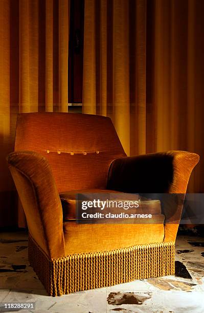 old armchair in a bed and breakfast. color image - recliner chair stock pictures, royalty-free photos & images