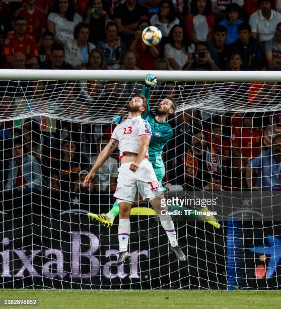 David De Gea of Spain, Rogvi Baldvinsson of Faroe Islands battle for the ball during the UEFA Euro 2020 qualifier match between Spain and Faroe...