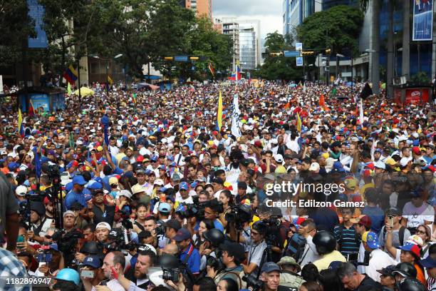 Supporters of opposition leader Juan Guaido, recognized by many members of the international community as the country's rightful interim ruler,...