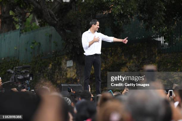Opposition leader Juan Guaido, recognized by many members of the international community as the country's rightful interim ruler, greets supporters...
